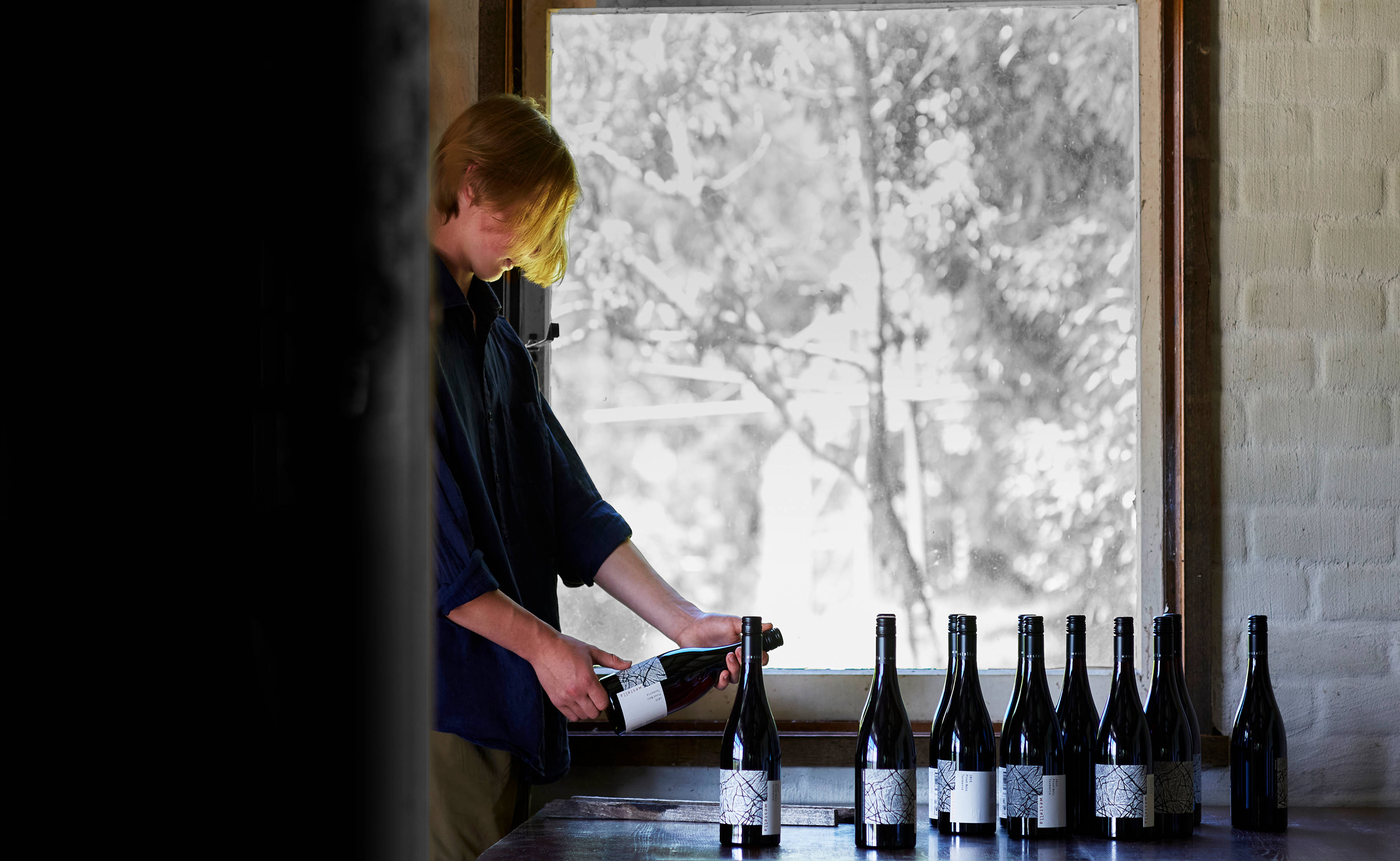Label inspection of the 2019 Westella Pinot Noir bottles. Photo: Renee Hodskiss.